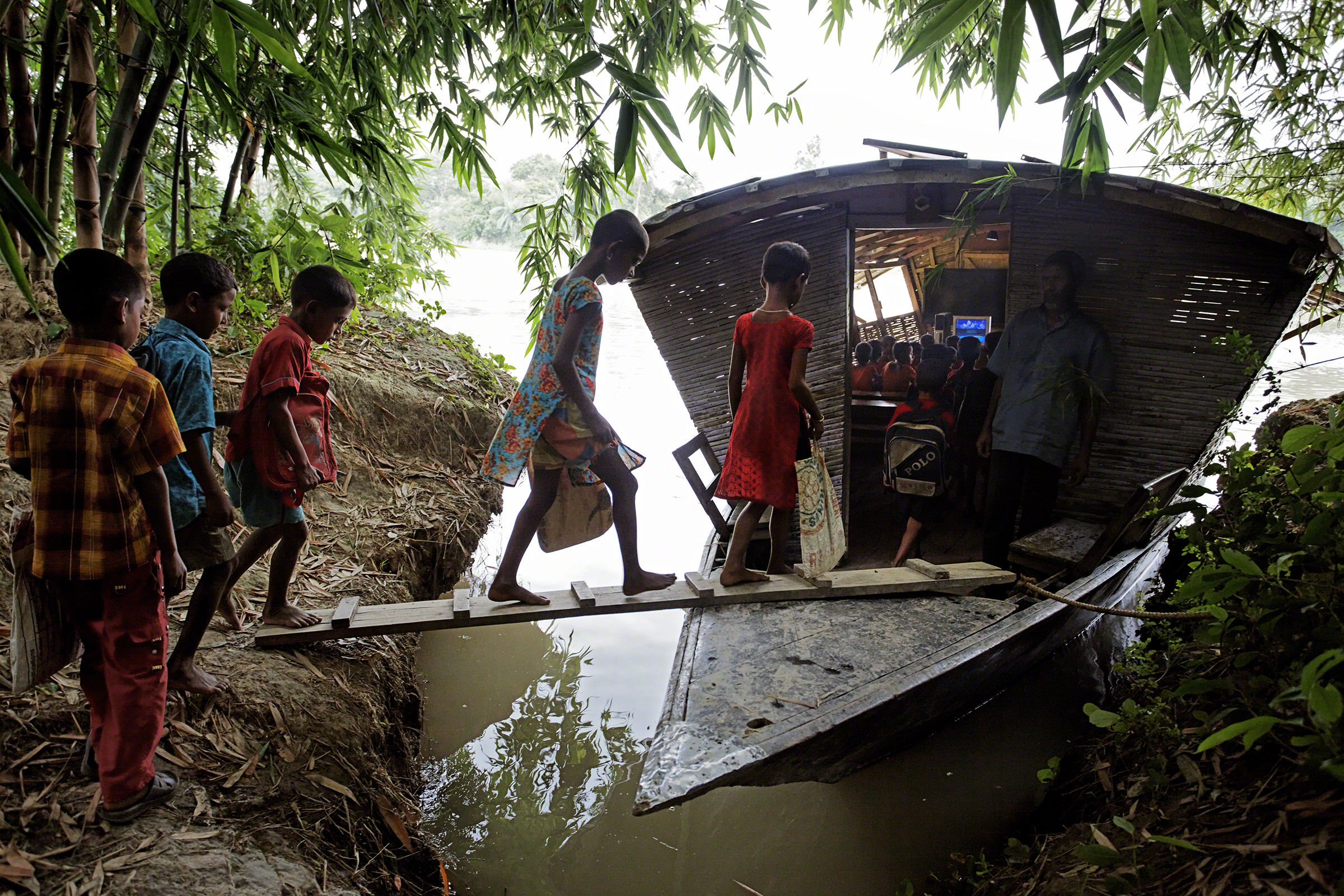 Pabna, Bangladesh, 2010. The nongovernmental organization Shidhulai Swanirvar Sangstha runs a fleet of more than 50 floating schools and libraries in an effort to provide basic education in a severely flood-prone area. Photo: Jonas Bendiksen