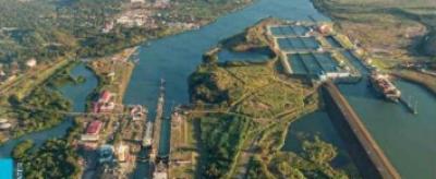 Aerial view of a canal with locks and surrounding greenery, featured on the cover of the 2023 "State of the Climate in Latin America and the Caribbean" report.