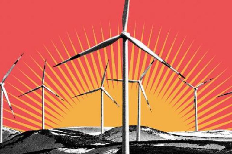 Wind turbines on a red background with mountains in the background.