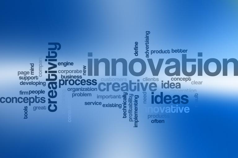 Word cloud centered around "innovation" with related business and creativity terms on a blue gradient background.
