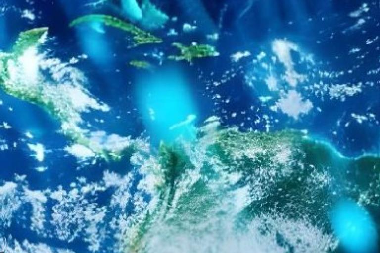 Satellite view of the Caribbean Sea, showing parts of Central America, northern South America, and several Caribbean islands under scattered clouds.