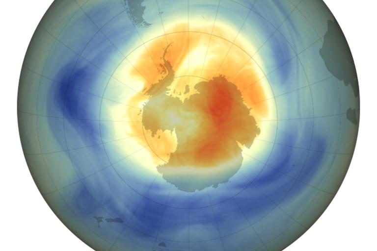 Map of the ozone layer over Antarctica showing low ozone concentrations in red and orange, and higher concentrations in blue, with a color bar indicating Dobson units.
