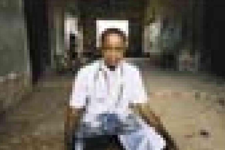 A man sitting on a bench.