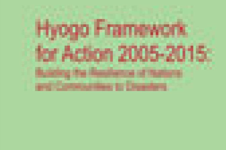 Blurry cover image with the text: "Hyogo Framework for Action 2005-2015: Building the Resilience of Nations and Communities to Disasters" on a green background.
