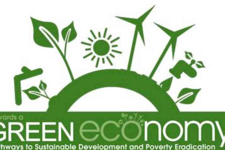 Green economy graphic with renewable energy symbols, plants, sun, and water tap, promoting sustainable development and poverty eradication. Text reads "Towards a Green Economy.