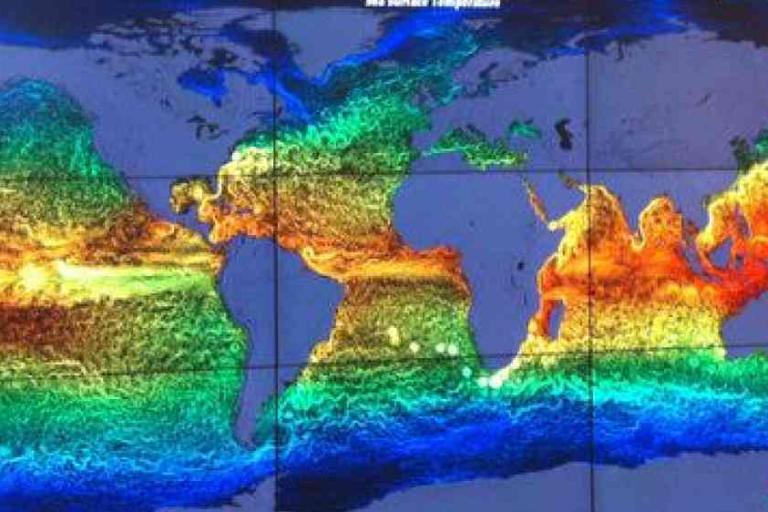 Color-coded world map showing ocean surface temperatures, with warmer areas in red and orange near the equator and cooler areas in green and blue toward the poles.