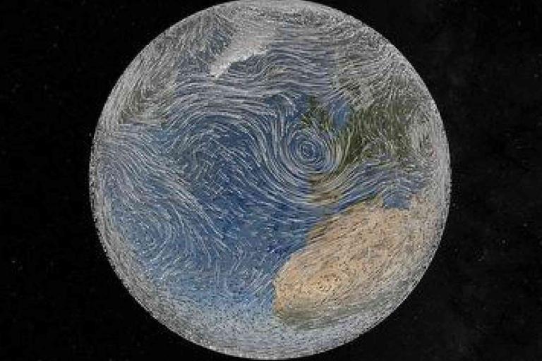 A view of Earth from space showing swirling wind patterns over the Atlantic Ocean, with parts of Europe and Africa visible.