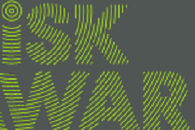 Green striped text on a dark background reads "RISK AWARE" in a bold, sans-serif font.