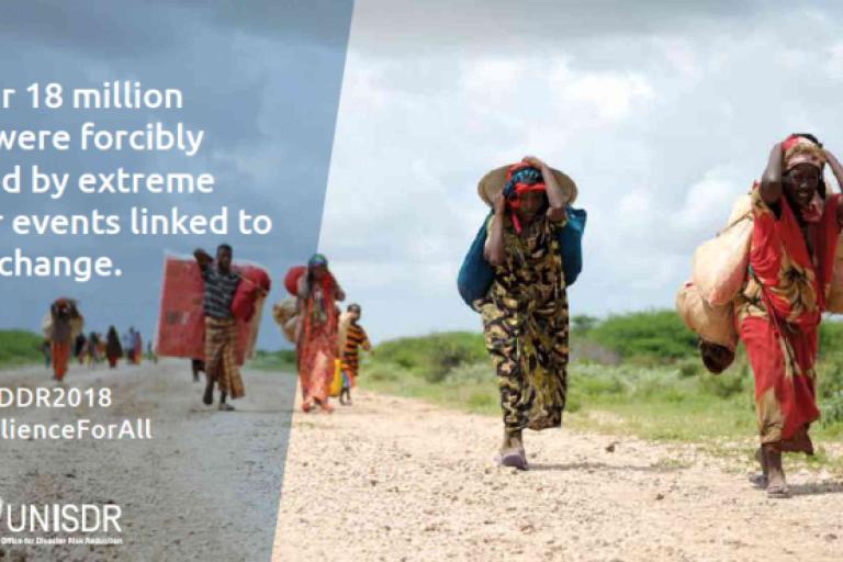 A group of people walks across a dry, barren landscape carrying belongings, illustrating forced displacement due to extreme weather and climate change.