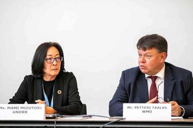 A man and woman sitting at a table.