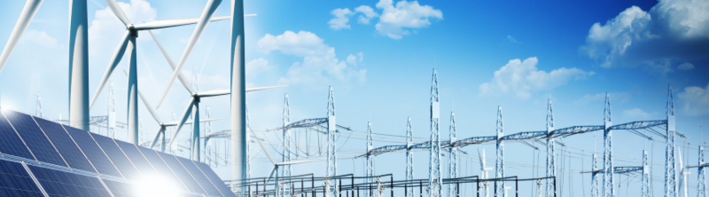 Image shows solar panels, wind mills and a power grid against a blu sky with small clouds