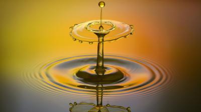 A drop of water on a yellow background