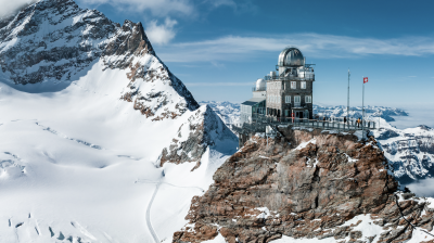 A building on top of a snow covered mountain.