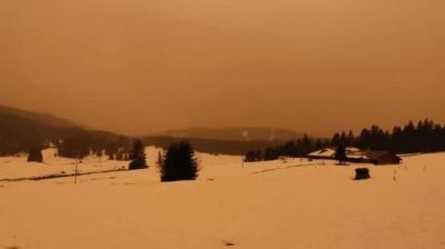 Sand storm is seen over a snowy field in the Jura mountains