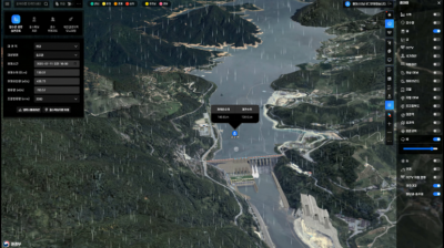 A satellite map interface shows a dam on a river surrounded by forested mountains, with data panels and weather effects displayed on the screen.