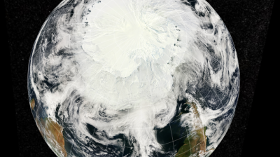 A satellite view of Earth focused on the South Pole, showing Antarctica covered in ice and clouds swirling over the Southern Hemisphere.
