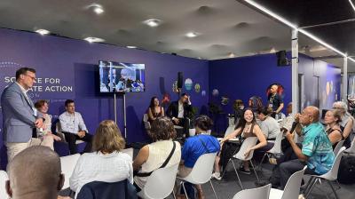 Group of people listening to a session at COP30 WMO Pavilion