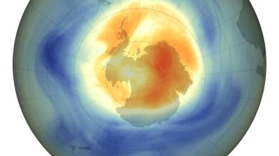 Map of the ozone layer over Antarctica showing low ozone concentrations in red and orange, and higher concentrations in blue, with a color bar indicating Dobson units.