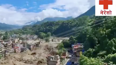 A flooded river runs through a town in a mountainous area; damaged buildings and debris are visible. A red cross with Nepali text appears in the top right corner.