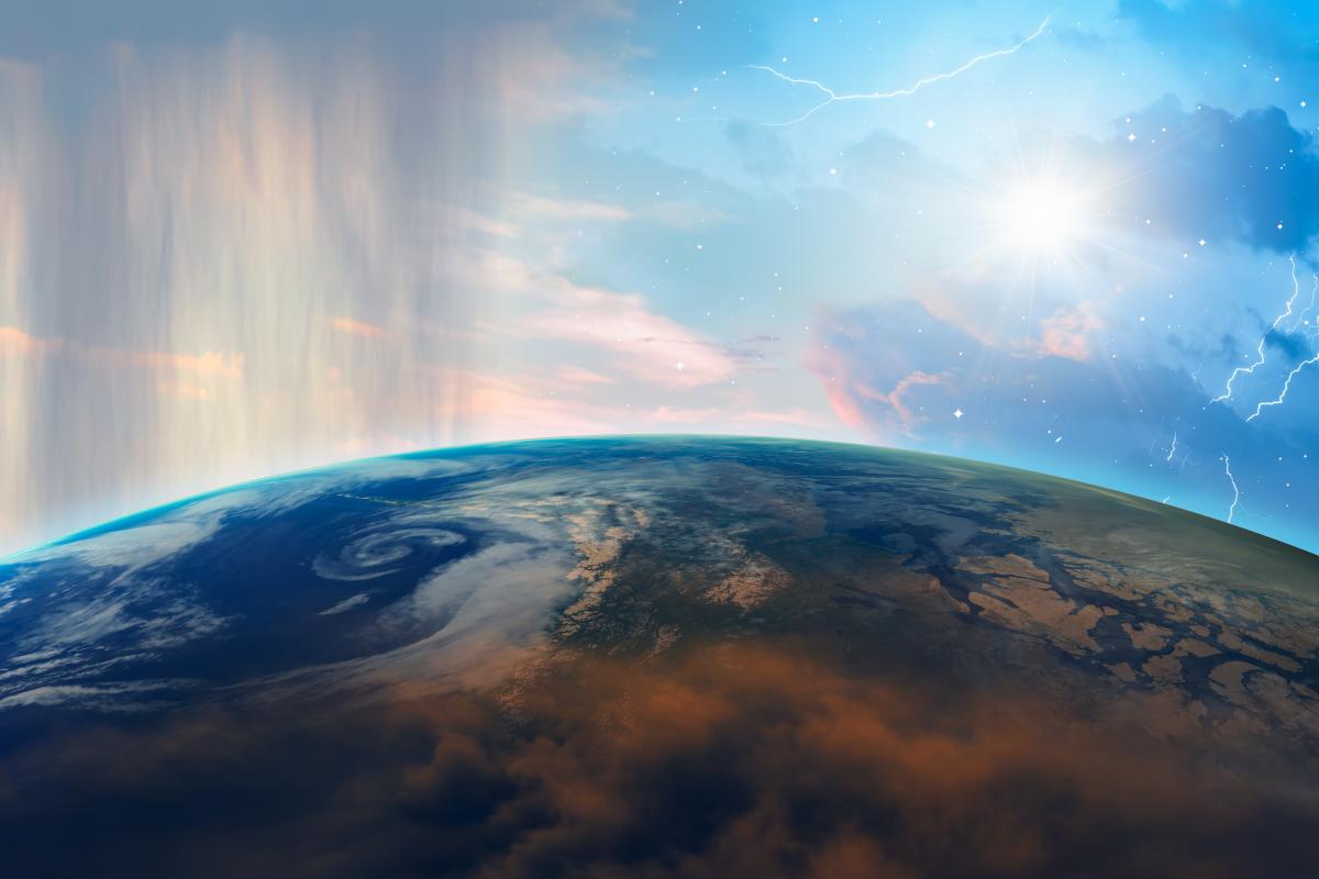 View of Earth from space showing clouds, weather patterns, sunlight, storm activity, and the sun shining above the horizon.
