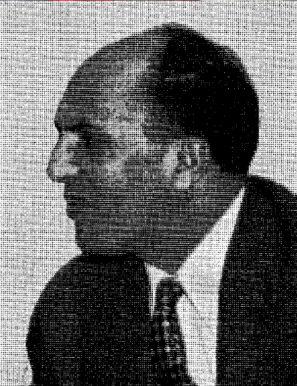 A black and white photo of a man in a suit.