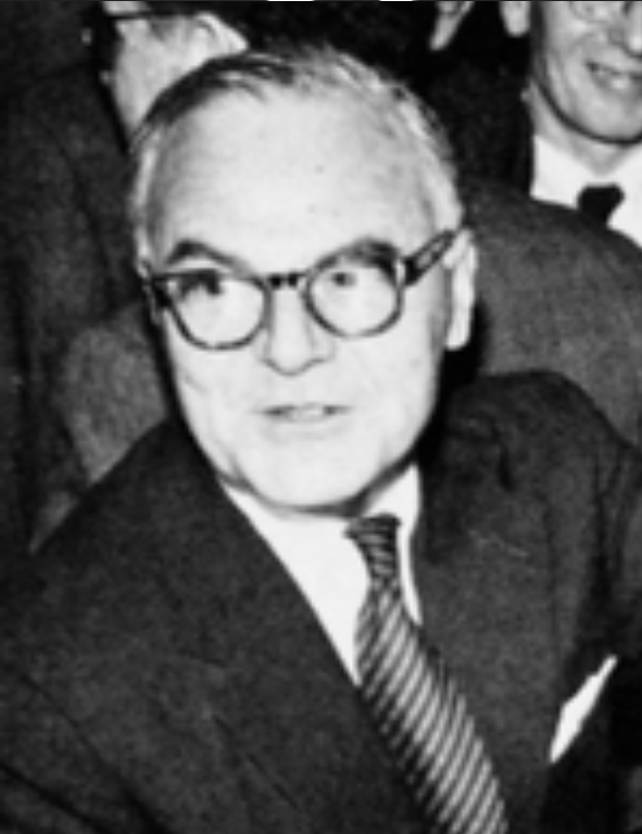 An old black and white photo of a man in glasses.