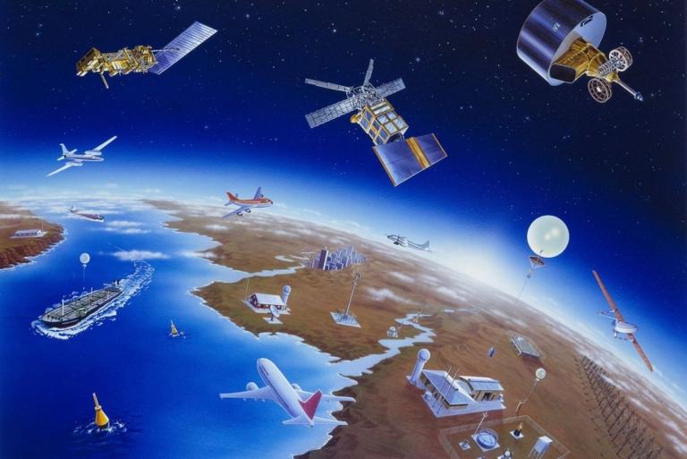 A painting of satellites flying around the earth.