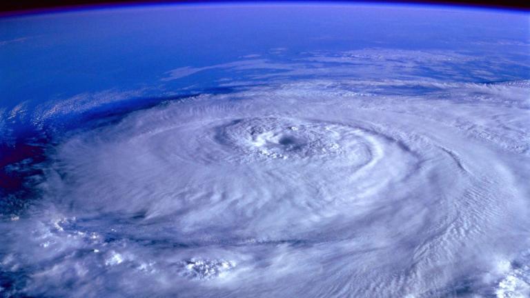 Tropical cyclone viewed from space, showcasing its spiral structure and vast scale.