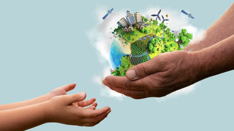 An adult's hands appear to be passing a miniature, verdant earth with various landscapes and human activities to a child's outstretched hands against a clear blue background.