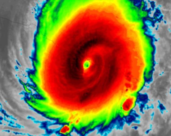 Colorful satellite imagery of a hurricane displaying a well-defined eye and intense convection.