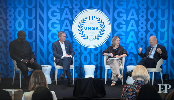 Four people sit on stage in front of a blue backdrop with "FP at UNGA 2023" text, participating in a panel discussion with an audience seated in the foreground.