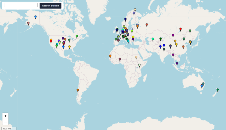 A world map displays colored location pins distributed across continents, indicating various data points or stations in North America, Europe, Africa, Asia, South America, and Oceania.
