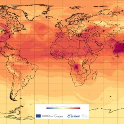 A heat map of the world displaying temperature anomalies, showing higher temperatures in dark red and lower temperatures in light orange.