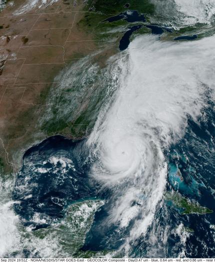 Satellite image of a large storm system over the southeastern United States and Gulf of Mexico, with dense cloud cover and a visible storm eye near the center.