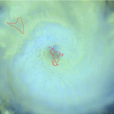 Satellite image showing the eye of a cyclone with swirling clouds around it. Red outlines mark landmasses. Meteo France logo is in the top right corner.