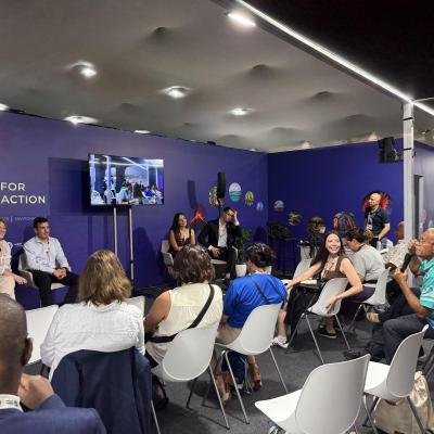 Group of people listening to a session at COP30 WMO Pavilion