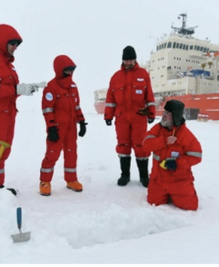 The members of the Roshydromet Transarctic expedition are taking snow samples for isotope analysis